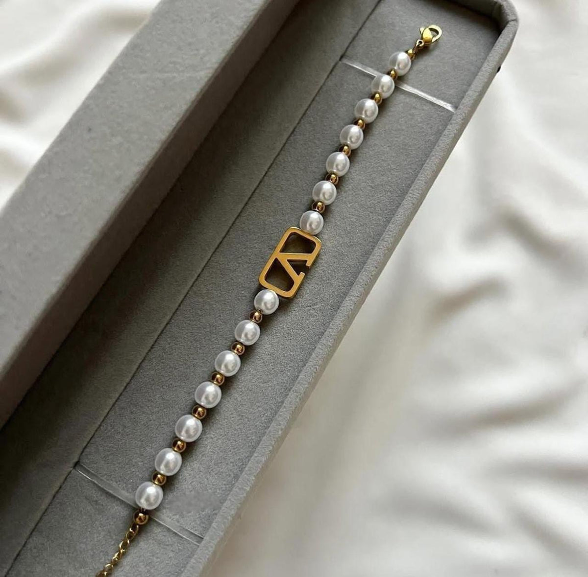 This is a Valentino Garavani VLogo Signature Pearl Bracelet