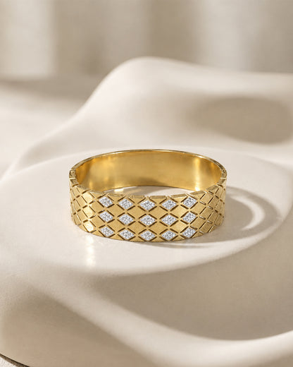This item is a Gold Quilted Bangle Bracelet with Mother-of-Pearl Inlays.