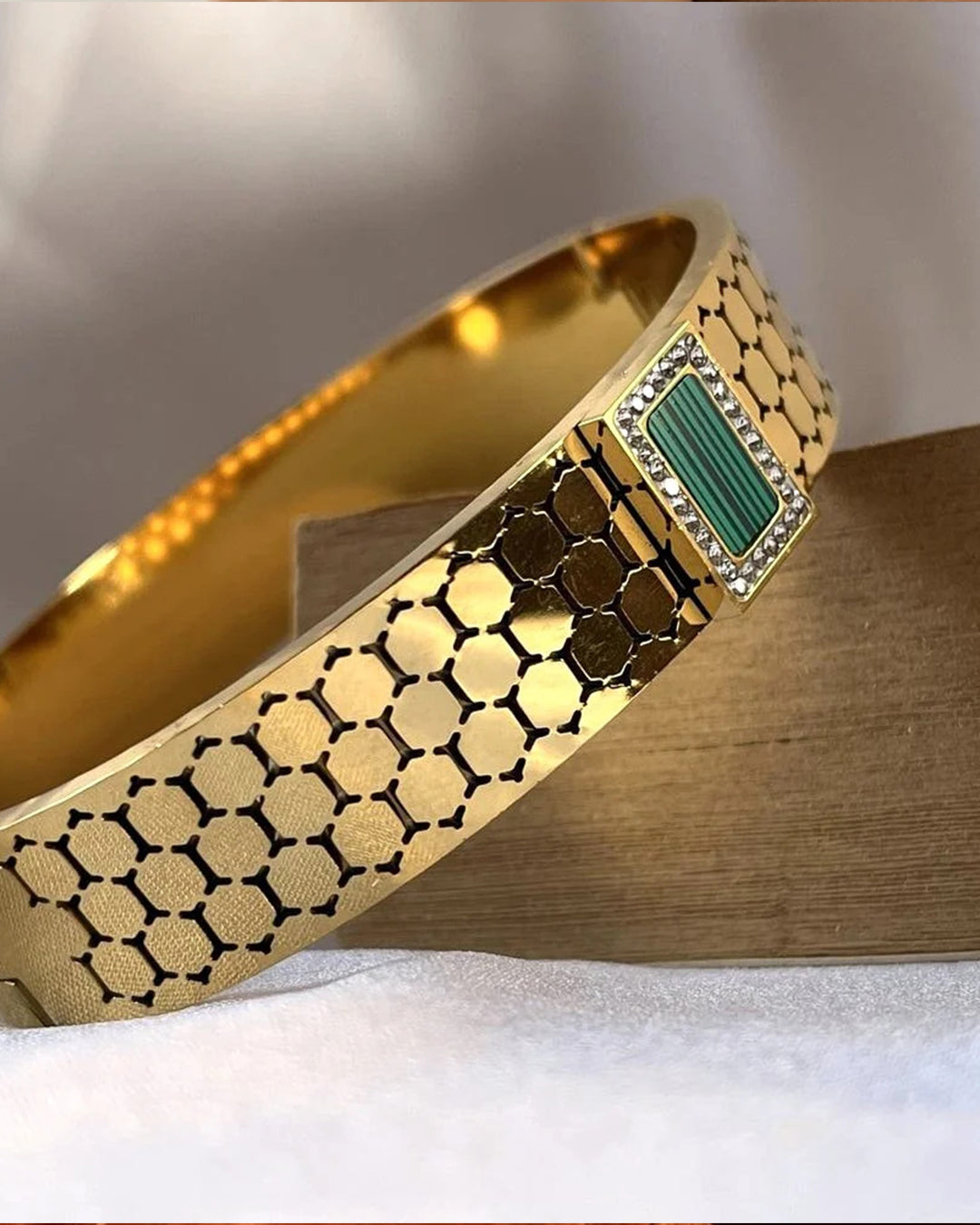 Gold mesh cuff bracelet with a green malachite stone center.