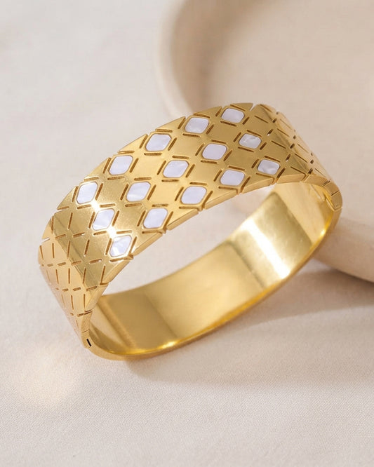 This item is a Gold Quilted Bangle Bracelet with Mother-of-Pearl Inlays.